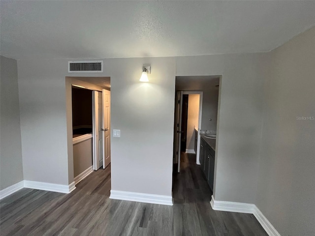 empty room with dark hardwood / wood-style floors