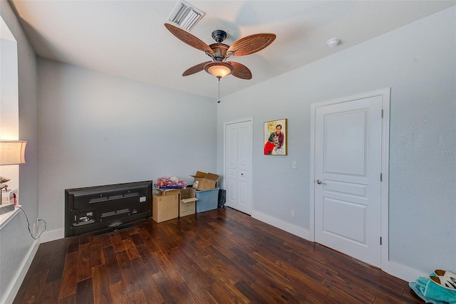 rec room with dark hardwood / wood-style flooring and ceiling fan