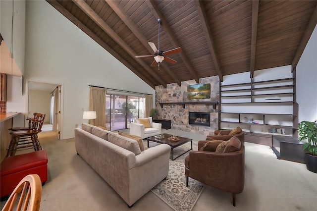 carpeted living room featuring beam ceiling, ceiling fan, high vaulted ceiling, a fireplace, and wood ceiling