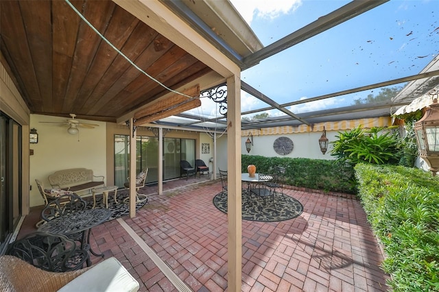 view of patio / terrace featuring a lanai and ceiling fan