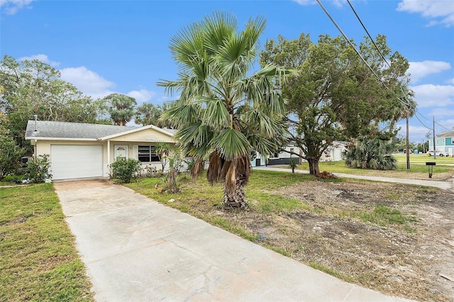 view of front facade with a garage and a front lawn