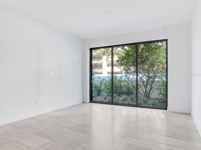 empty room featuring light tile patterned floors