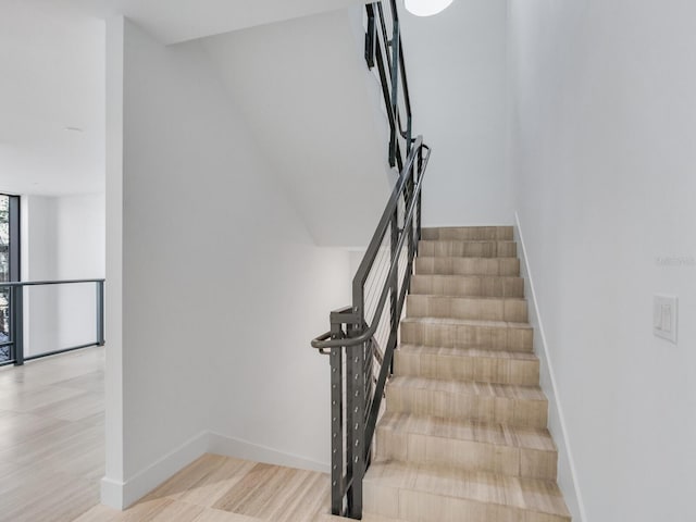 stairs with wood-type flooring