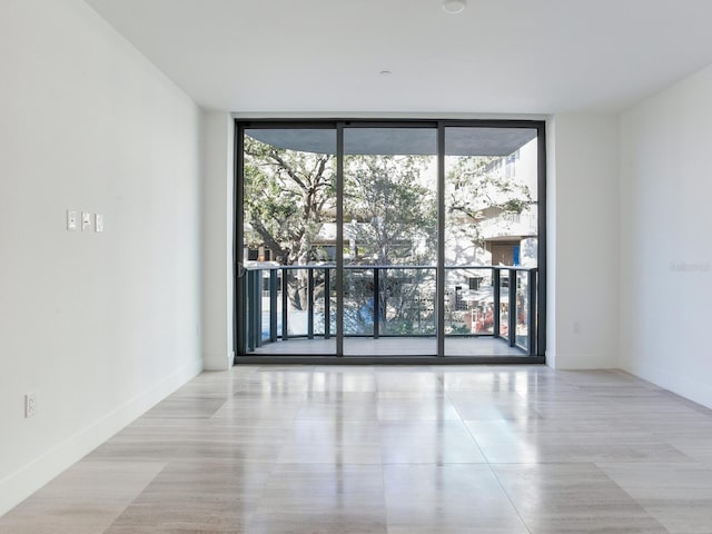 empty room featuring floor to ceiling windows