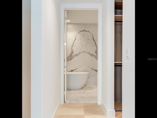 bathroom featuring a tub to relax in