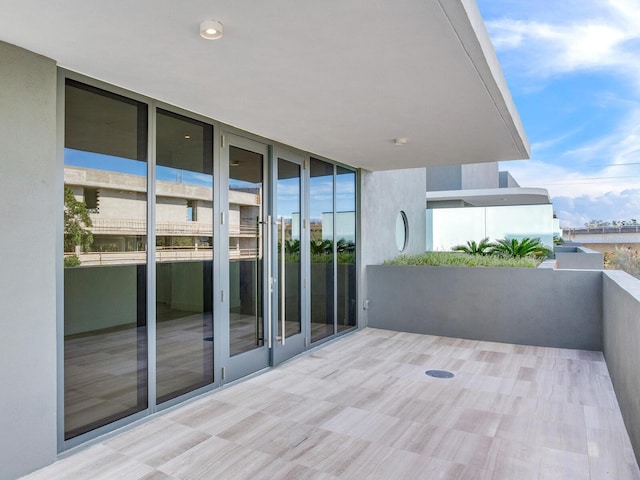 view of patio featuring a balcony