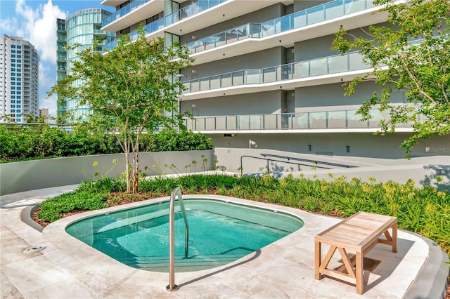 view of pool featuring a community hot tub