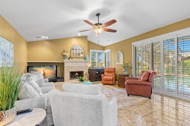 living room with ceiling fan and lofted ceiling