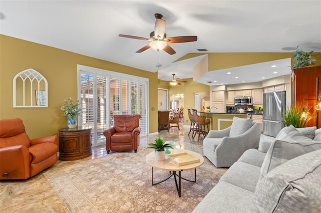 living room with ceiling fan and lofted ceiling