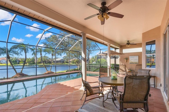 exterior space featuring ceiling fan, a water view, and a pool