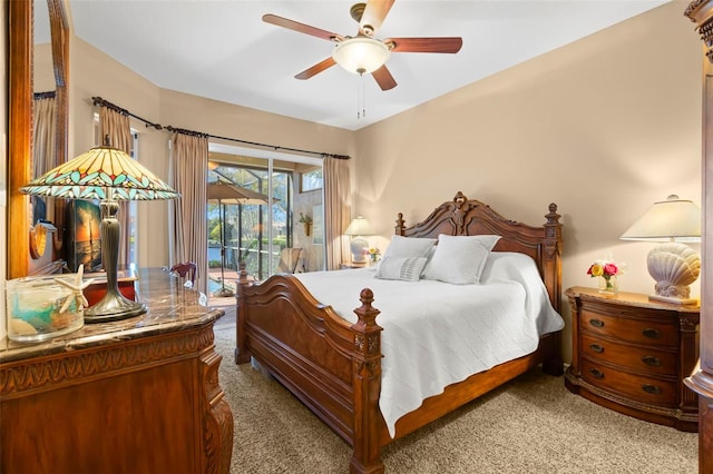 carpeted bedroom featuring access to exterior and ceiling fan