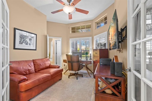 home office with french doors and ceiling fan