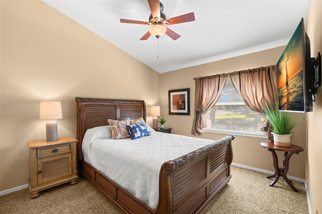 bedroom featuring lofted ceiling, light colored carpet, and ceiling fan