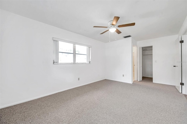 unfurnished bedroom featuring ceiling fan, carpet flooring, and a closet