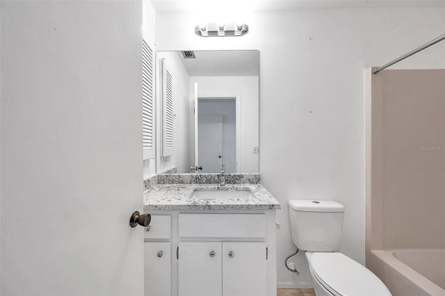 full bathroom with vanity, toilet, and washtub / shower combination