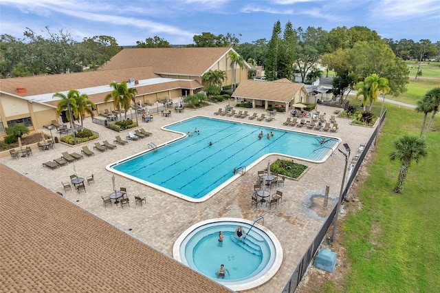 view of swimming pool with a patio and a jacuzzi