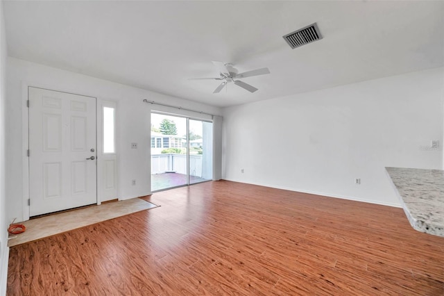 foyer entrance featuring light hardwood / wood-style flooring and ceiling fan