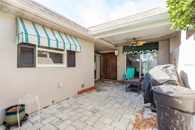 view of patio / terrace featuring ceiling fan