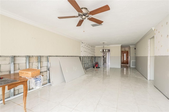 unfurnished room with a textured ceiling, ceiling fan with notable chandelier, and crown molding