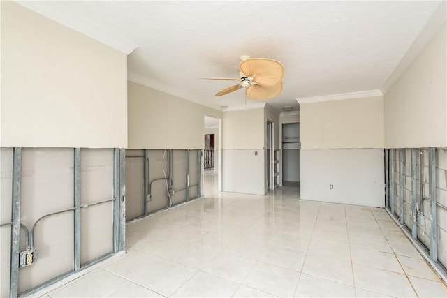 unfurnished room with ceiling fan, light tile patterned flooring, and ornamental molding