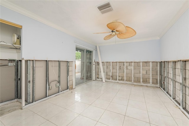 tiled spare room featuring crown molding and ceiling fan