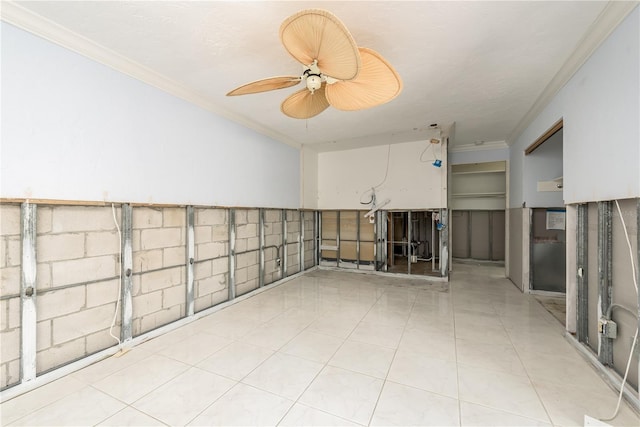 unfurnished room featuring light tile patterned floors, a textured ceiling, and ornamental molding