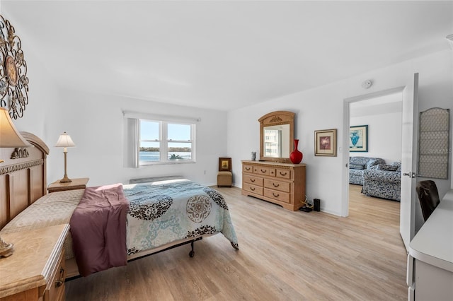 bedroom with light hardwood / wood-style floors