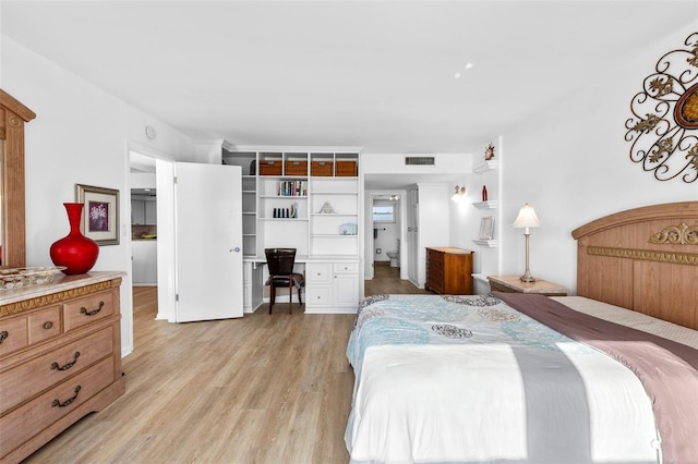 bedroom with light hardwood / wood-style flooring