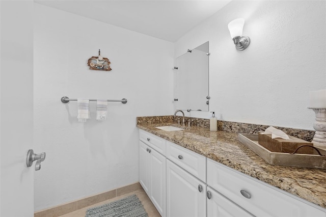 bathroom featuring tile patterned floors and vanity