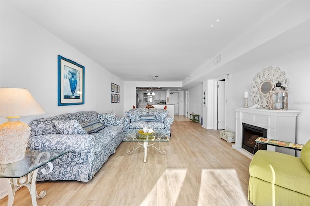 living room with light hardwood / wood-style floors