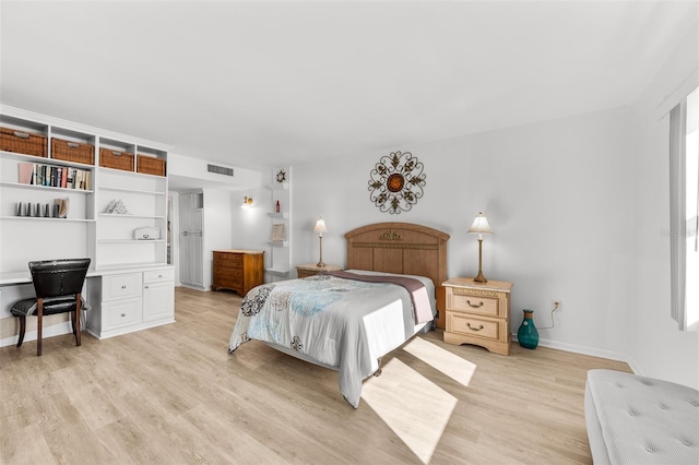 bedroom with light wood-type flooring