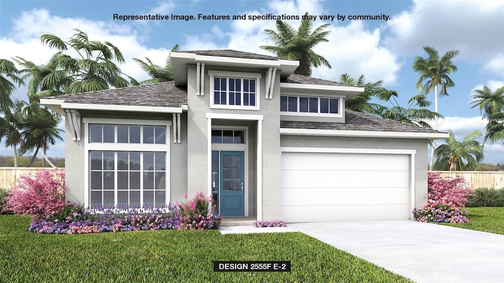 prairie-style home featuring a garage and a front lawn