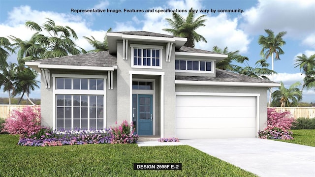 prairie-style home featuring a garage and a front lawn