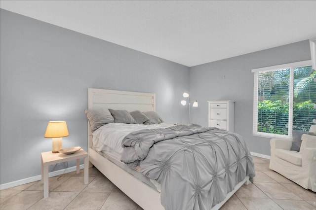 bedroom featuring light tile patterned floors