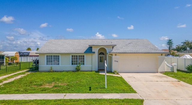 ranch-style home with a garage and a front yard