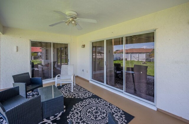 view of patio with outdoor lounge area and ceiling fan