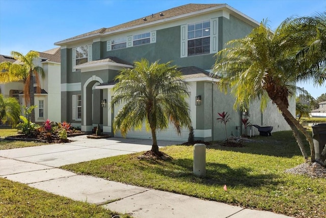 mediterranean / spanish house with a front lawn