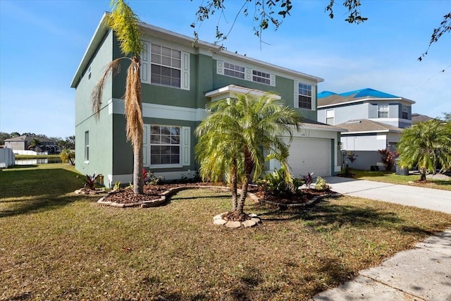 view of front of home with a garage and a front yard