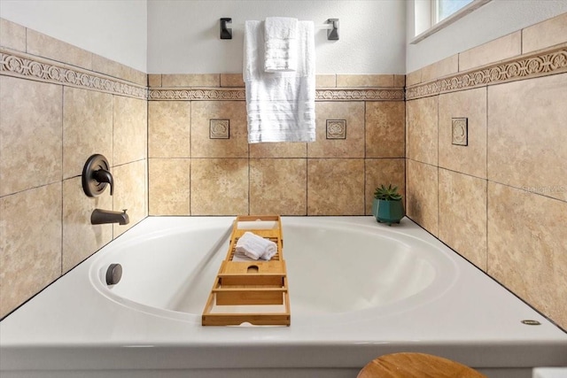 bathroom with a tub to relax in