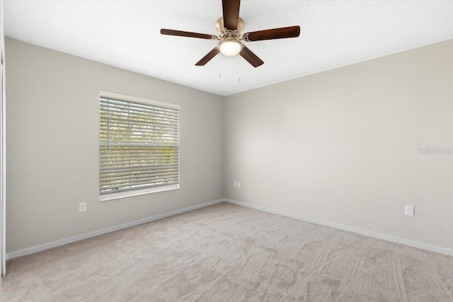 carpeted empty room with ceiling fan