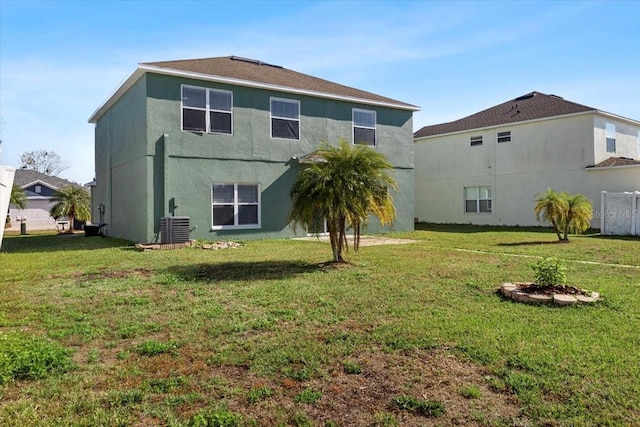 back of property featuring a yard and cooling unit