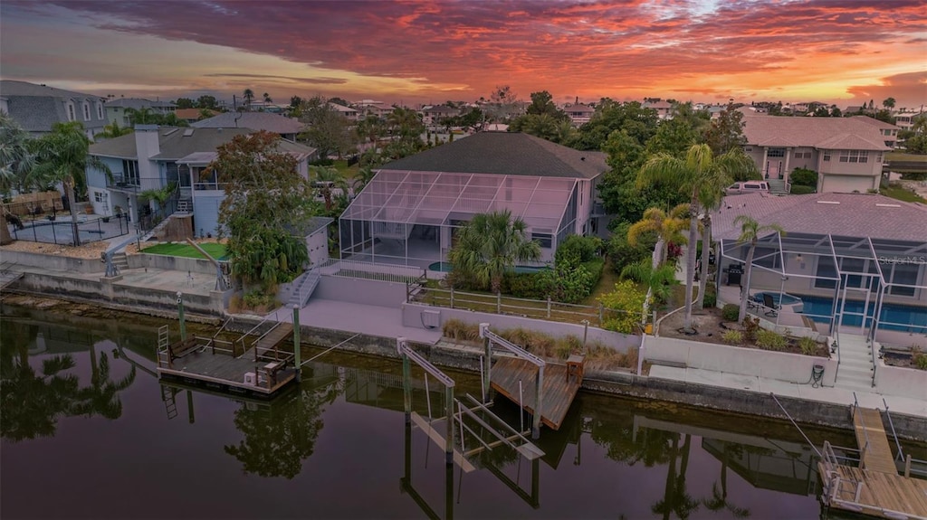 bird's eye view with a water view and a residential view