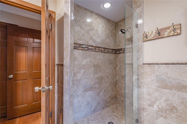 bathroom featuring tiled shower