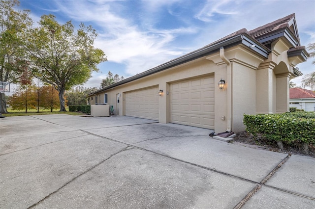 view of property exterior featuring a garage