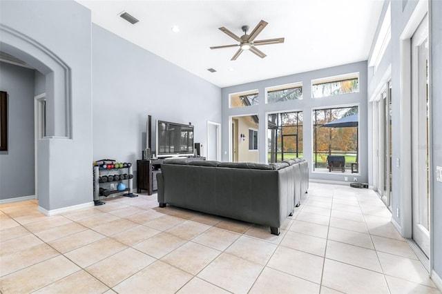 living room featuring ceiling fan and light tile patterned floors