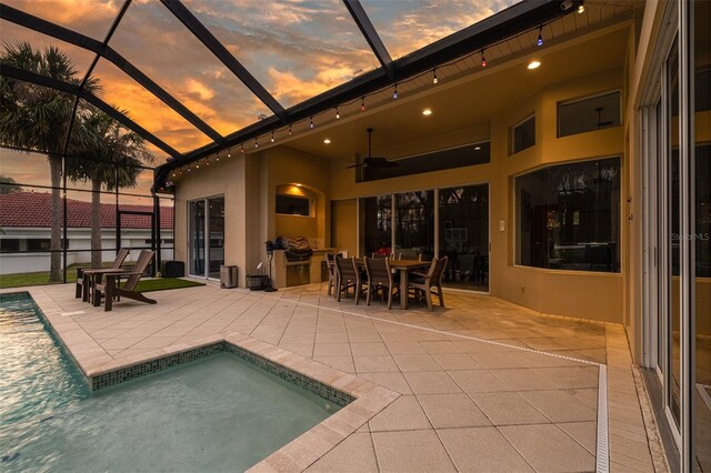 exterior space featuring a lanai, ceiling fan, and a patio area