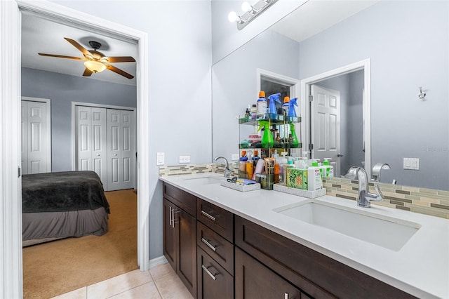 bathroom featuring vanity, backsplash, tile patterned floors, and ceiling fan