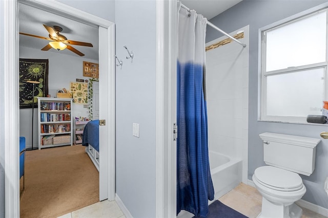 bathroom featuring tile patterned floors, ceiling fan, shower / tub combo with curtain, and toilet