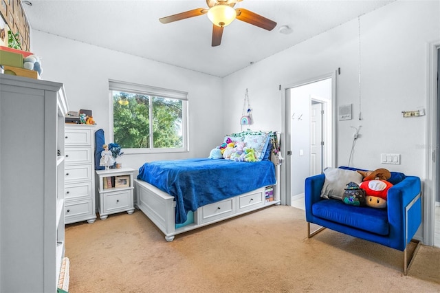 bedroom featuring ceiling fan and light carpet