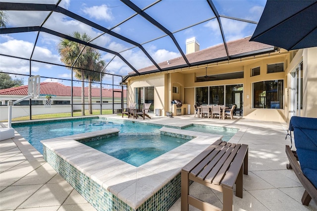 view of pool featuring ceiling fan, a patio area, a lanai, and an in ground hot tub